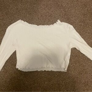 Ripped long sleeve, wide shoulders, fringed